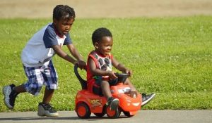 Pullen creatives kids playing car ride joy boys black boys children little